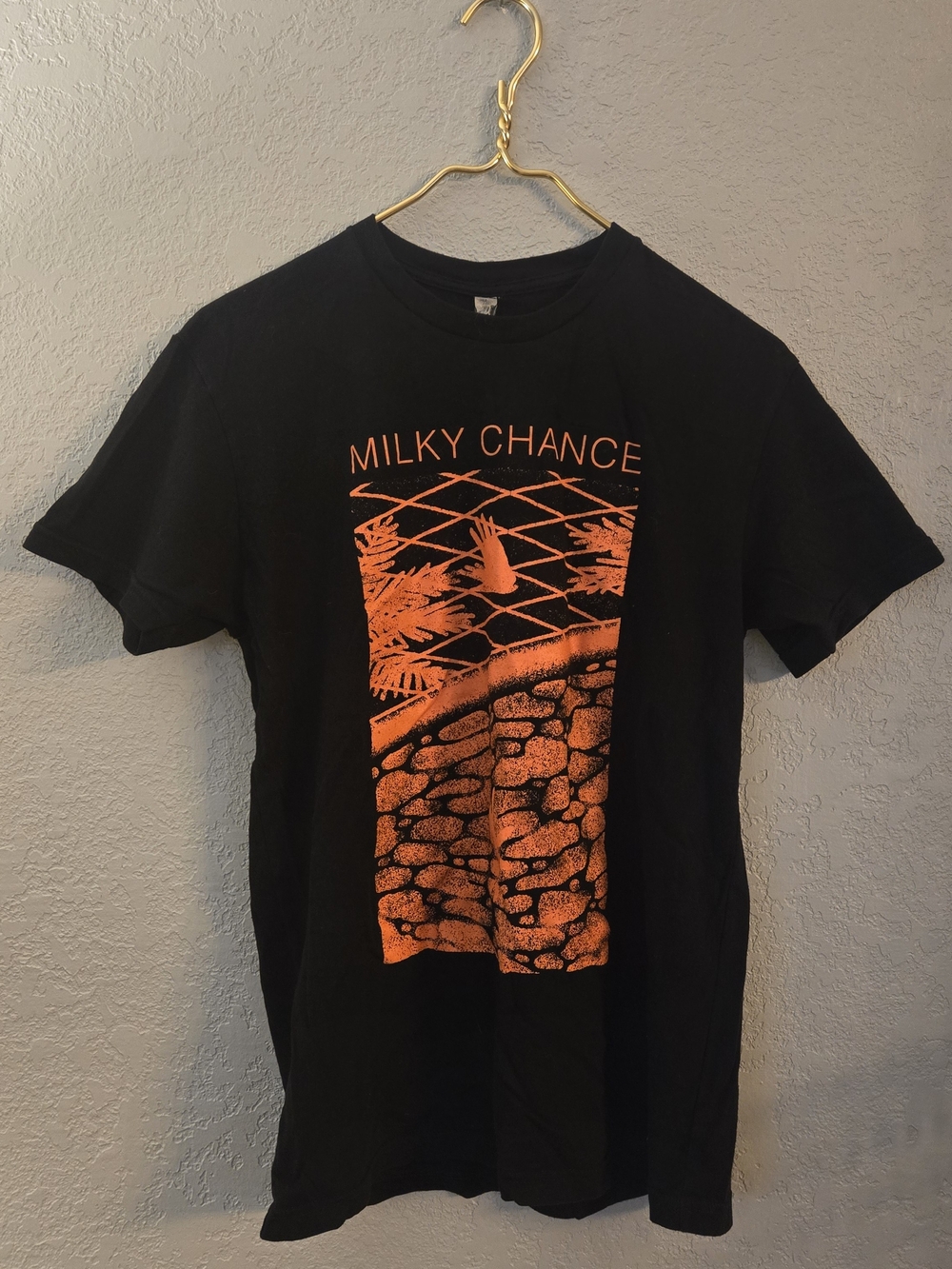 Next Level Apparel Black Tee with Orange Milky Chance Graphic